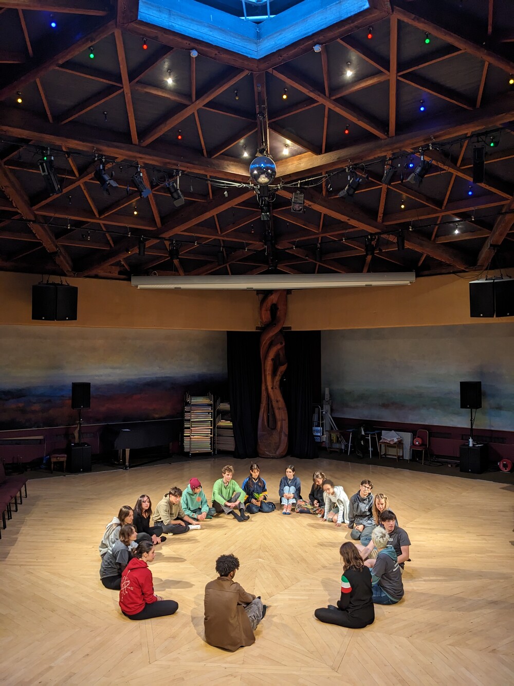 People sitting in a circle on floor